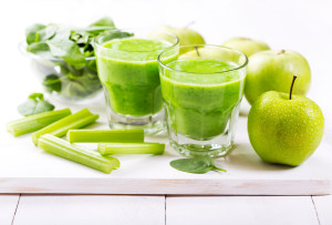 glasses of  green juice with apple and spinach